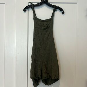 Women’s hunter green overalls with adjustable straps and pocket